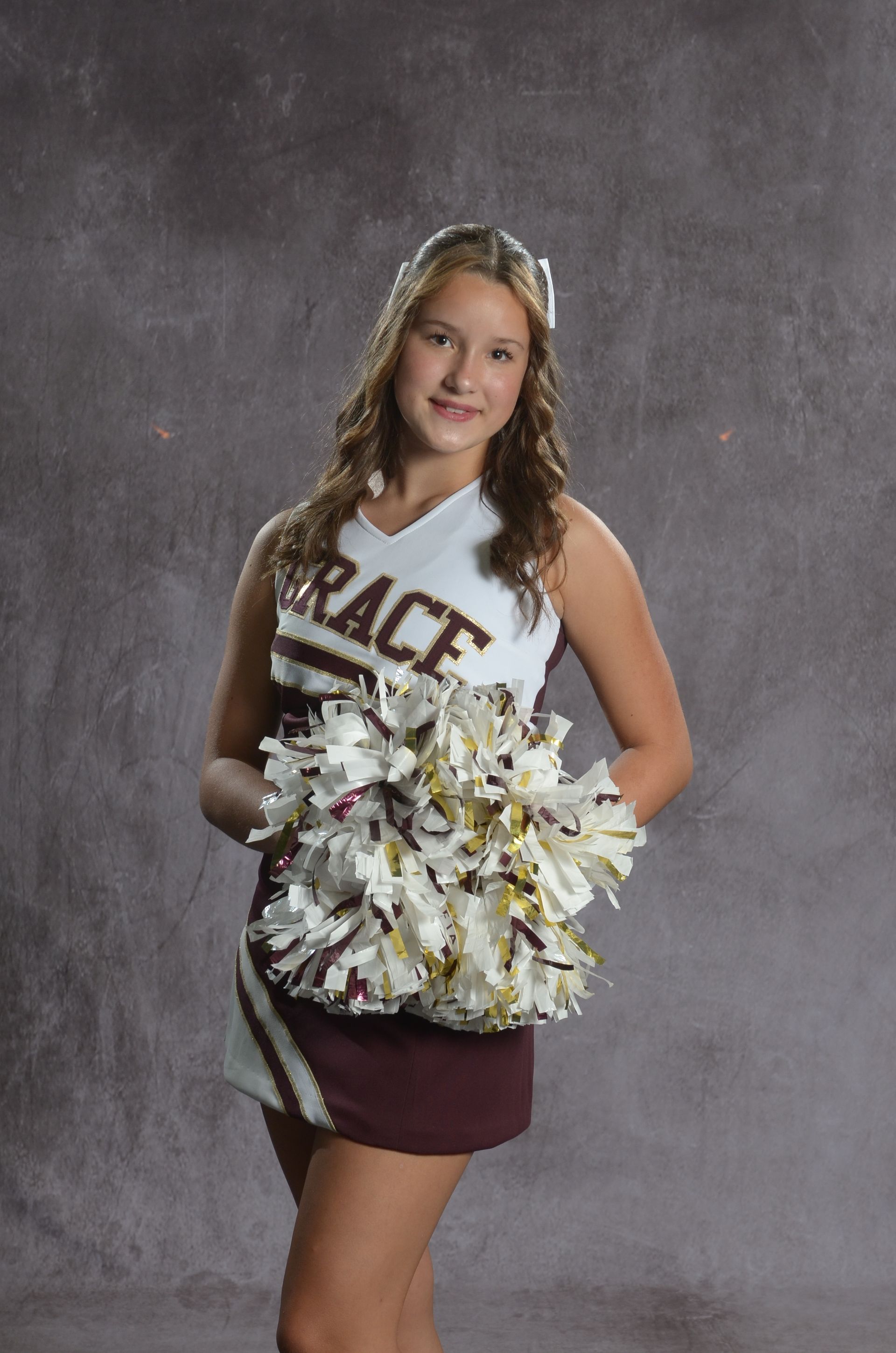 Eagle head logo in maroon and gold.