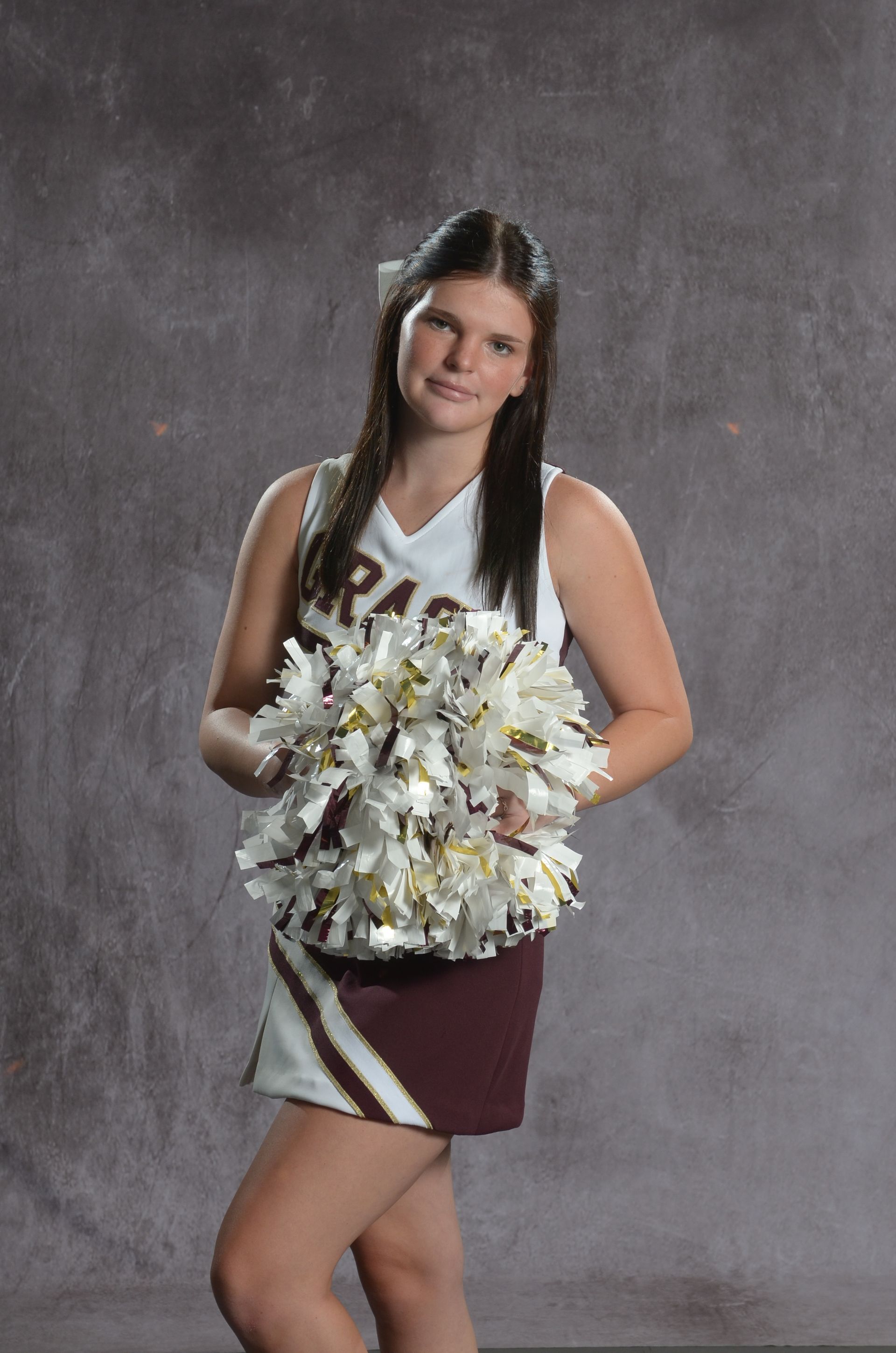 Eagle head logo in maroon and gold.