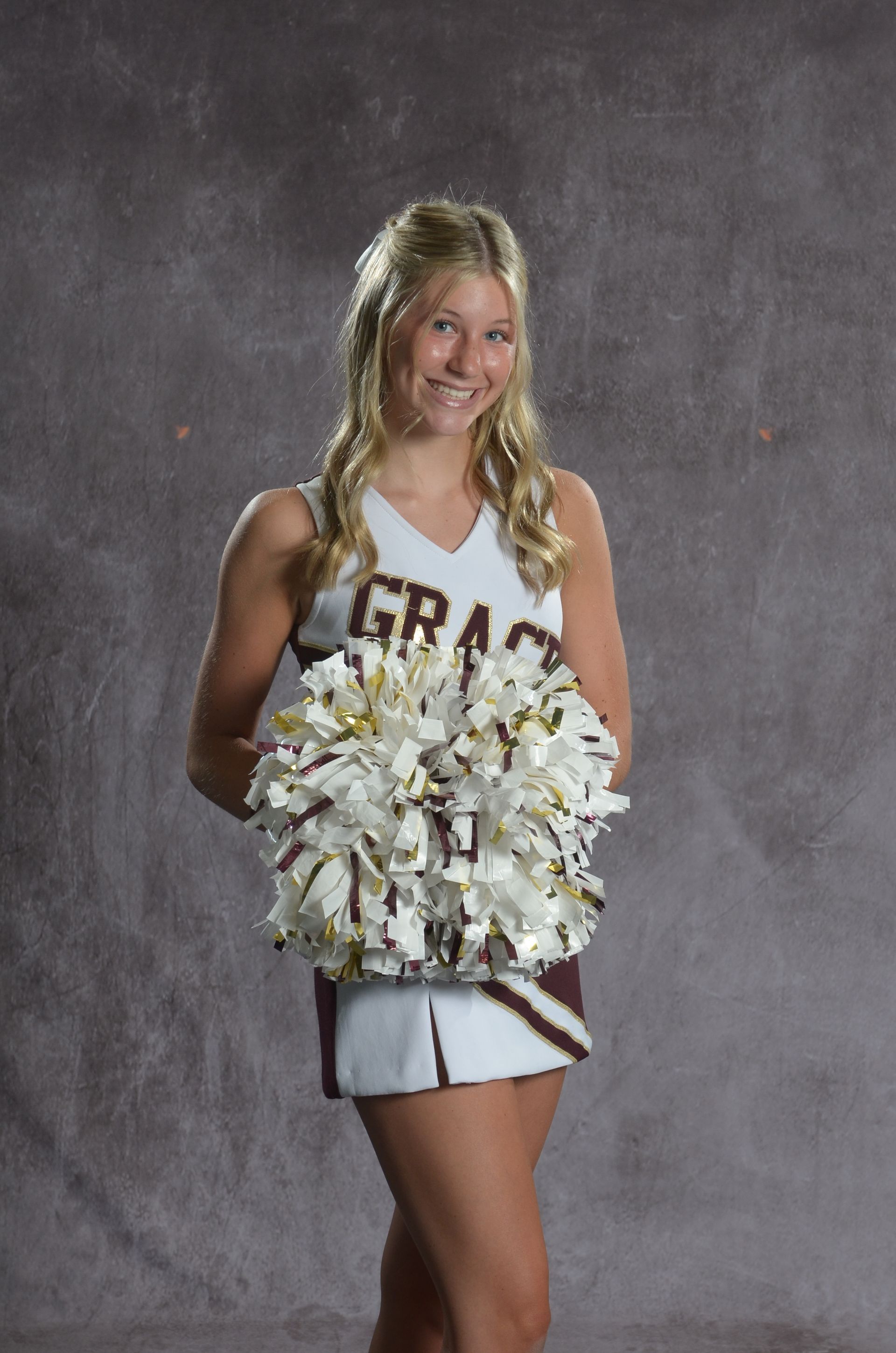 Eagle head logo in maroon and gold.