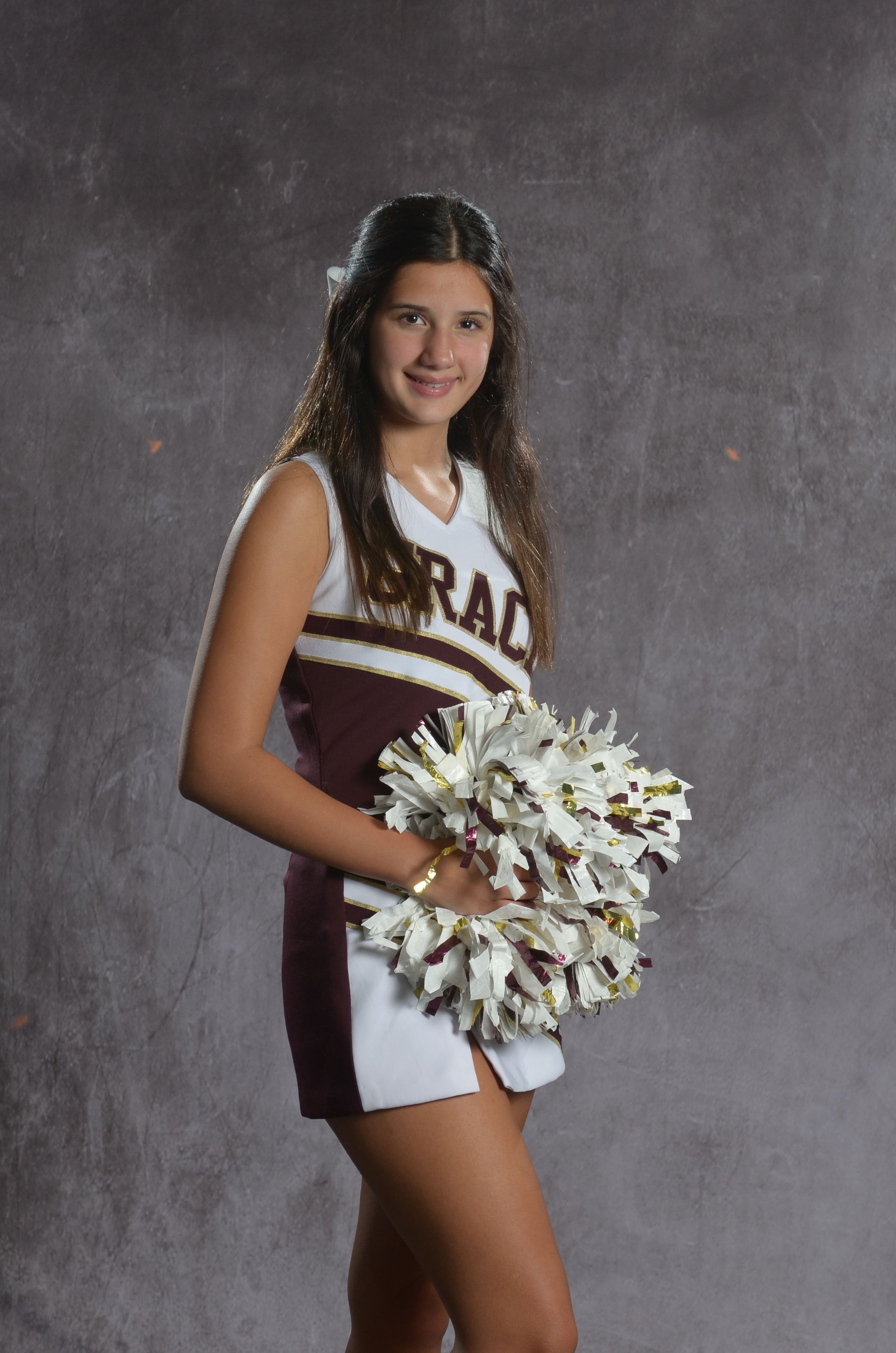 Eagle head logo in maroon and gold.