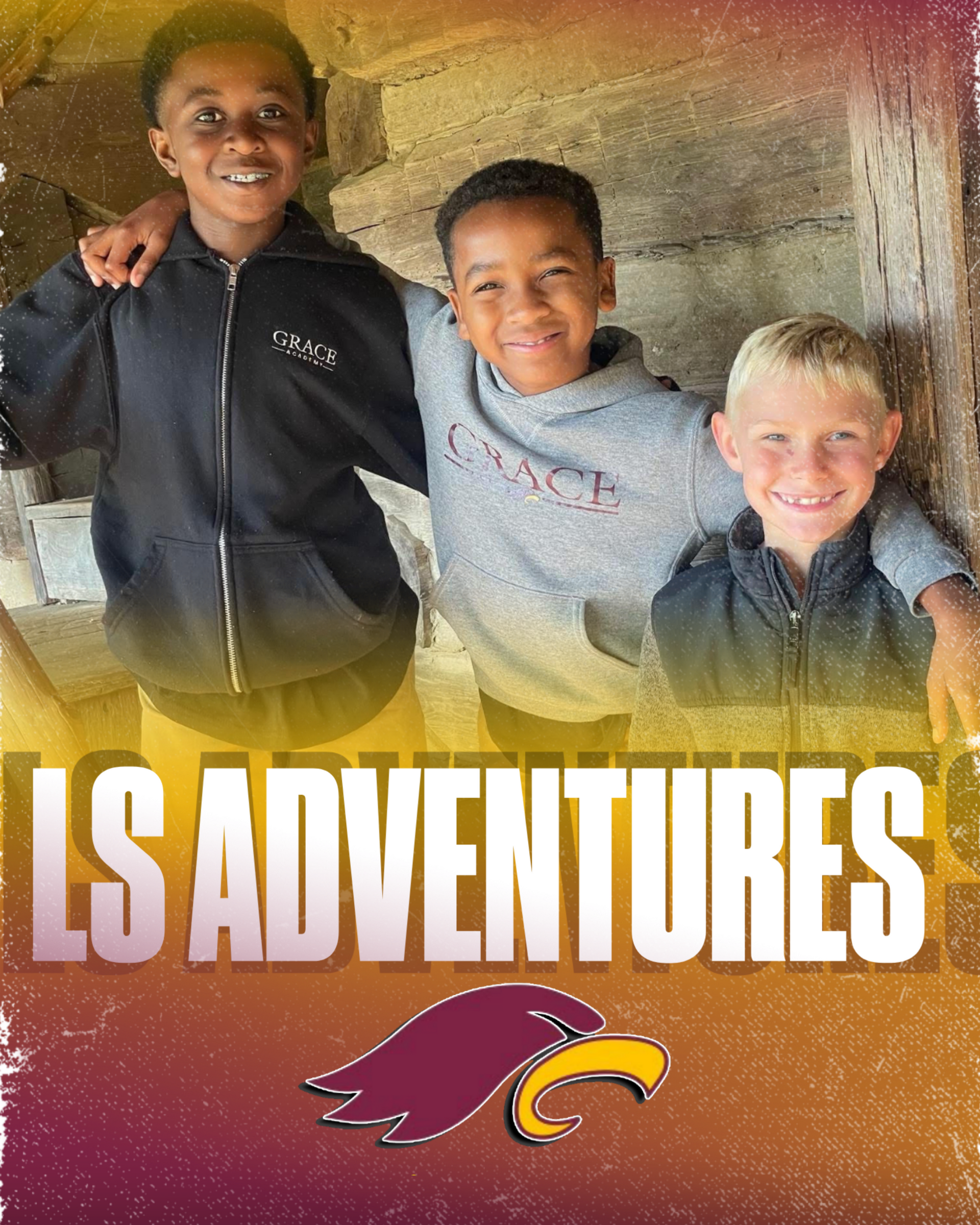 Four smiling children in school uniforms, two boys and two girls, posing indoors.
