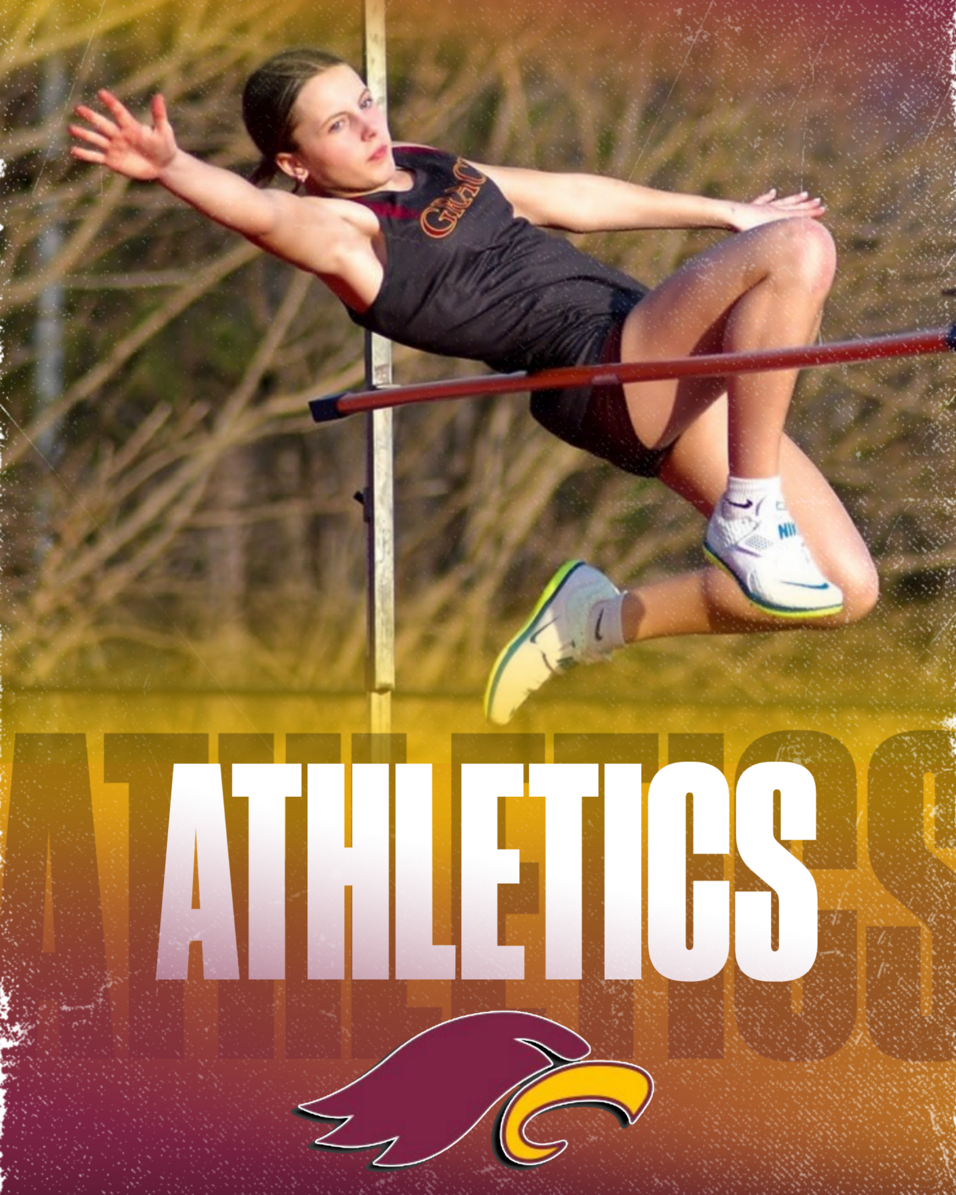 A girls' soccer team in maroon uniforms kneels on a grassy field with their coach.