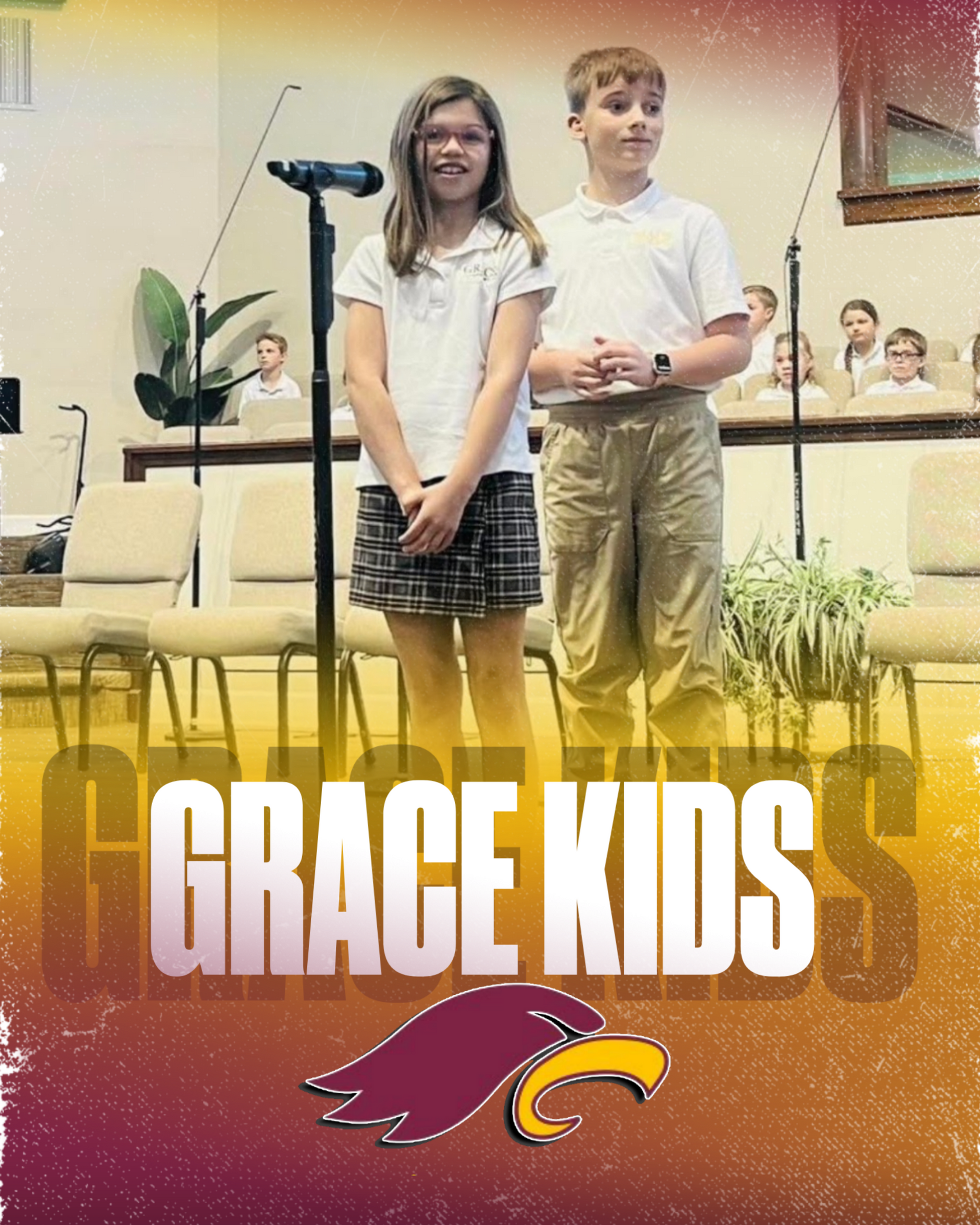 Four smiling children in school uniforms, two boys and two girls, posing indoors.