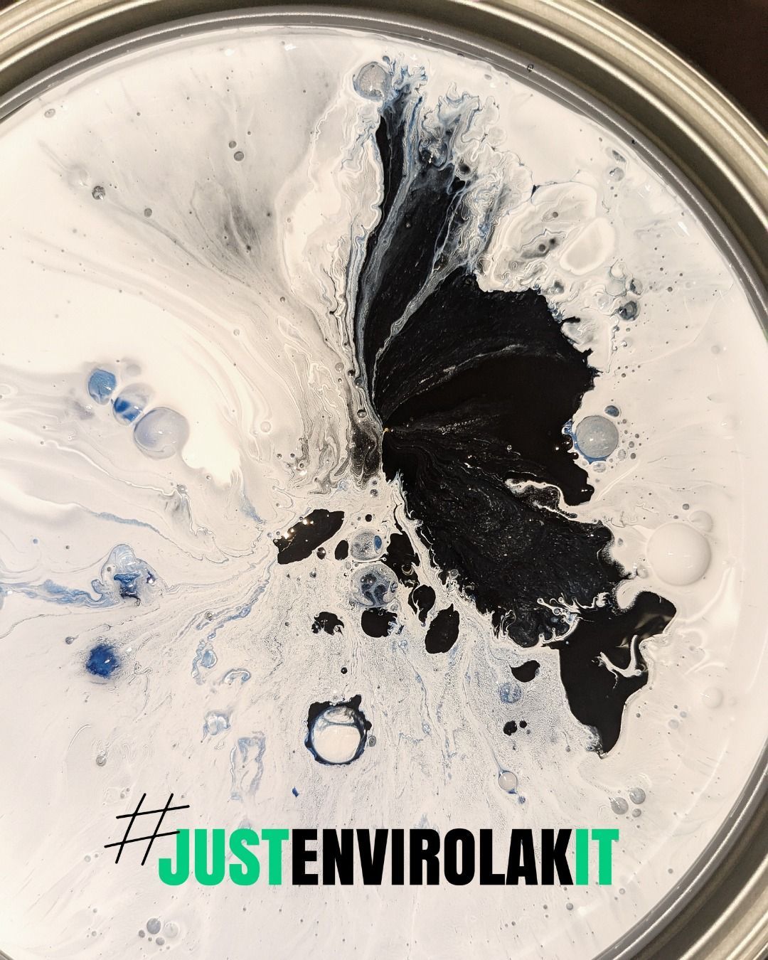 A can of paint has the hashtag #justenvirolakit on it