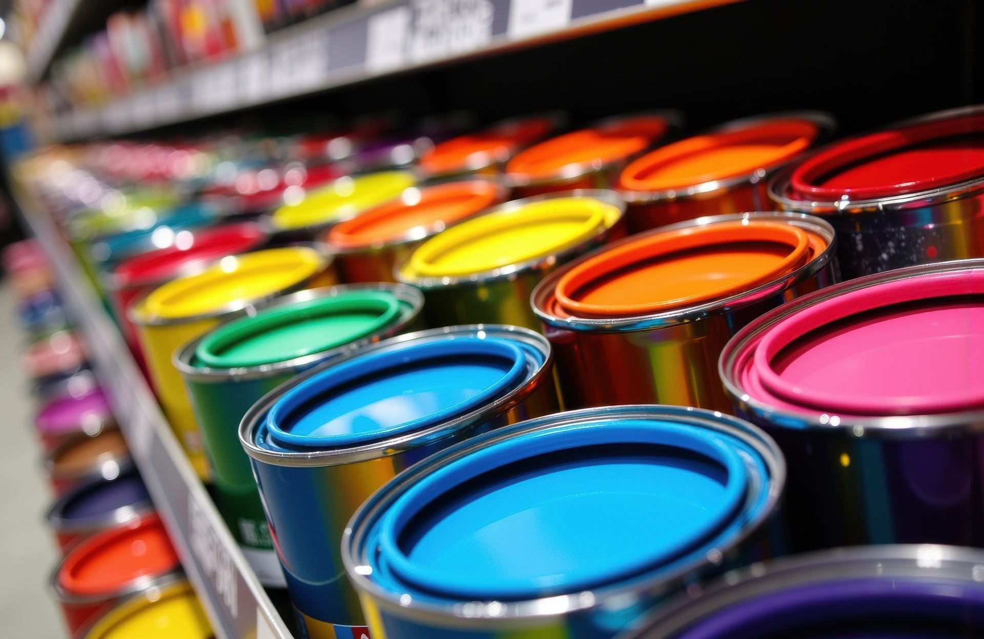 Colourful paint cans arranged on a store. Colourful paint cans arranged on a store.
