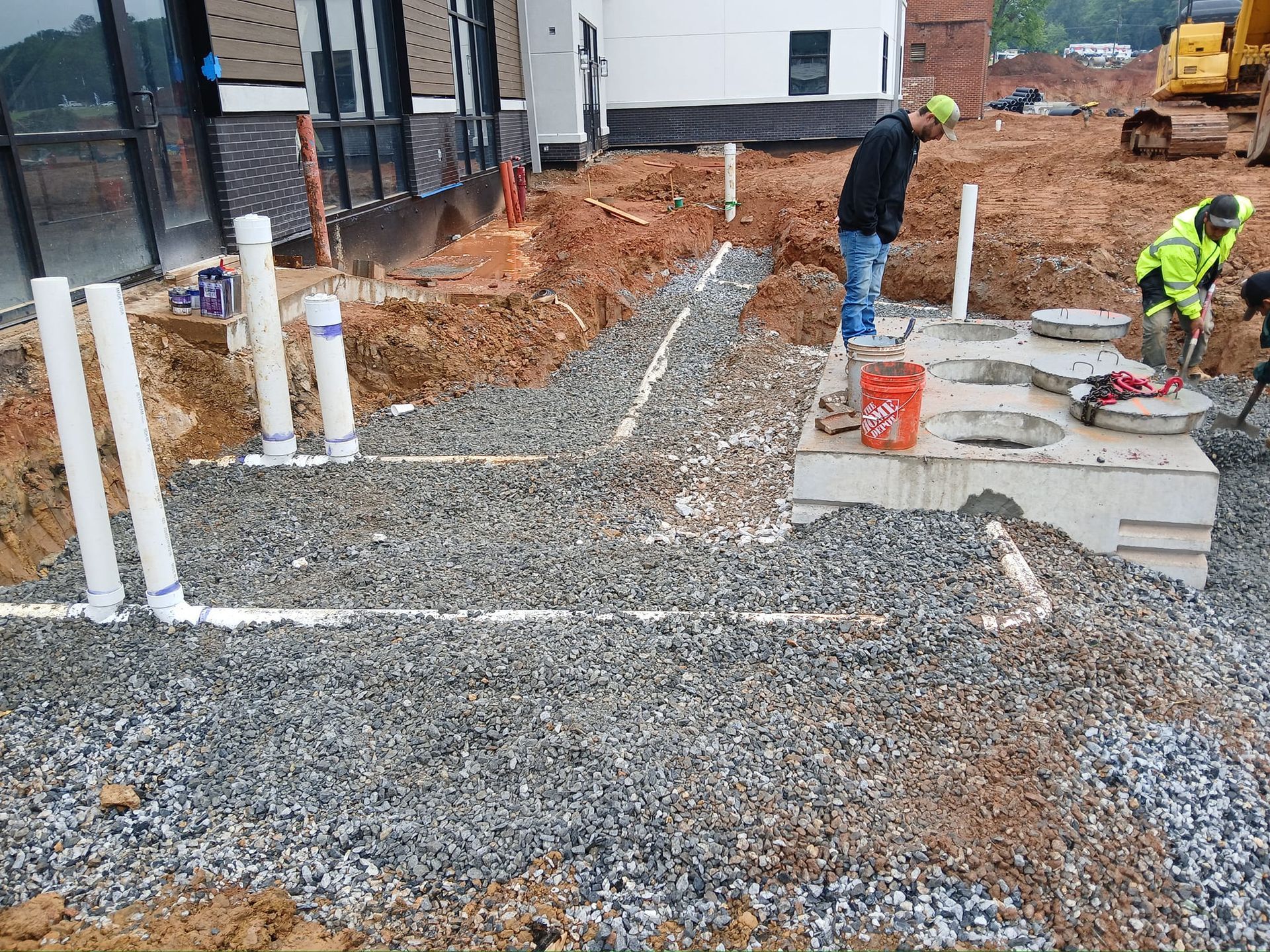 A group of construction workers are working on a construction site.