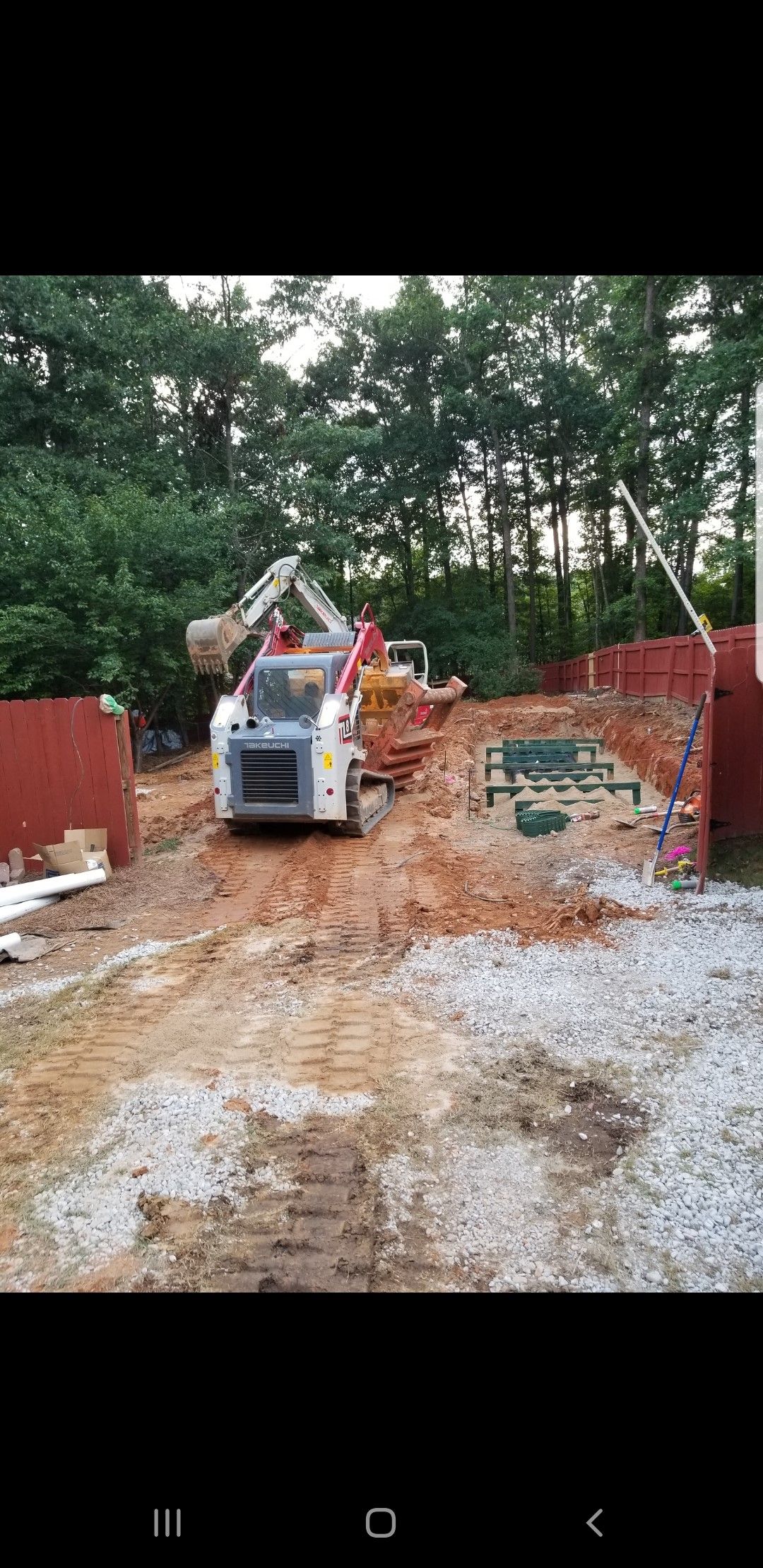 A bulldozer is moving dirt on a construction site.
