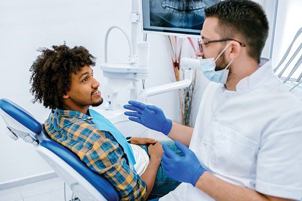 Patient Being Examined by Dentist — Albuquerque, NM — New Mexico Endodontic Specialists