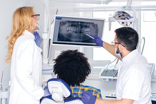 Dentist Explaining Tooth X-Ray to a Male Patient — Albuquerque, NM — New Mexico Endodontic Specialists