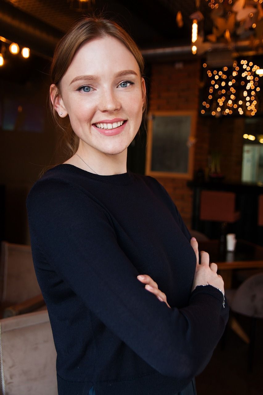 Happy businesswoman smiling, representing success and confidence, featured on the eLearning Course page.