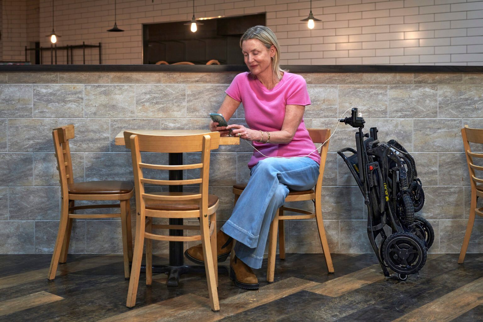 woman with folded wheelchair