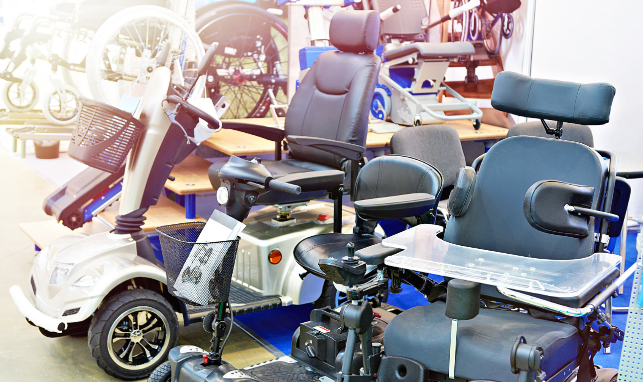 A group of mobility scooters are sitting next to each other in a room.