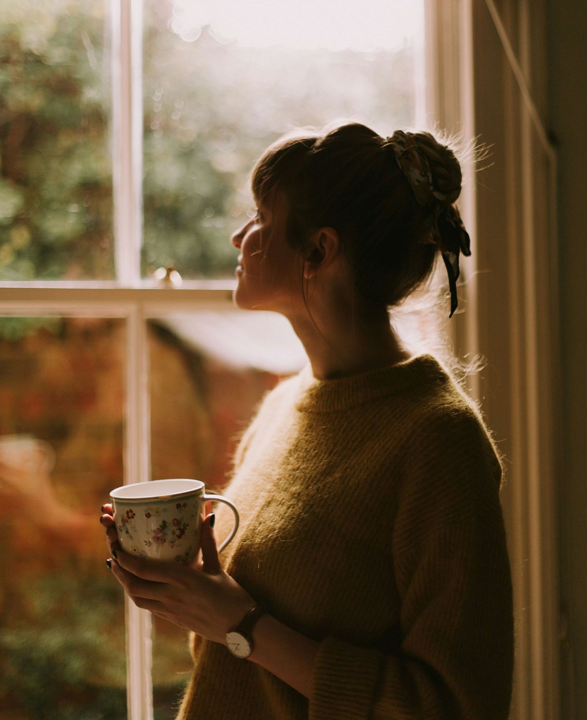 woman drinking tea at home