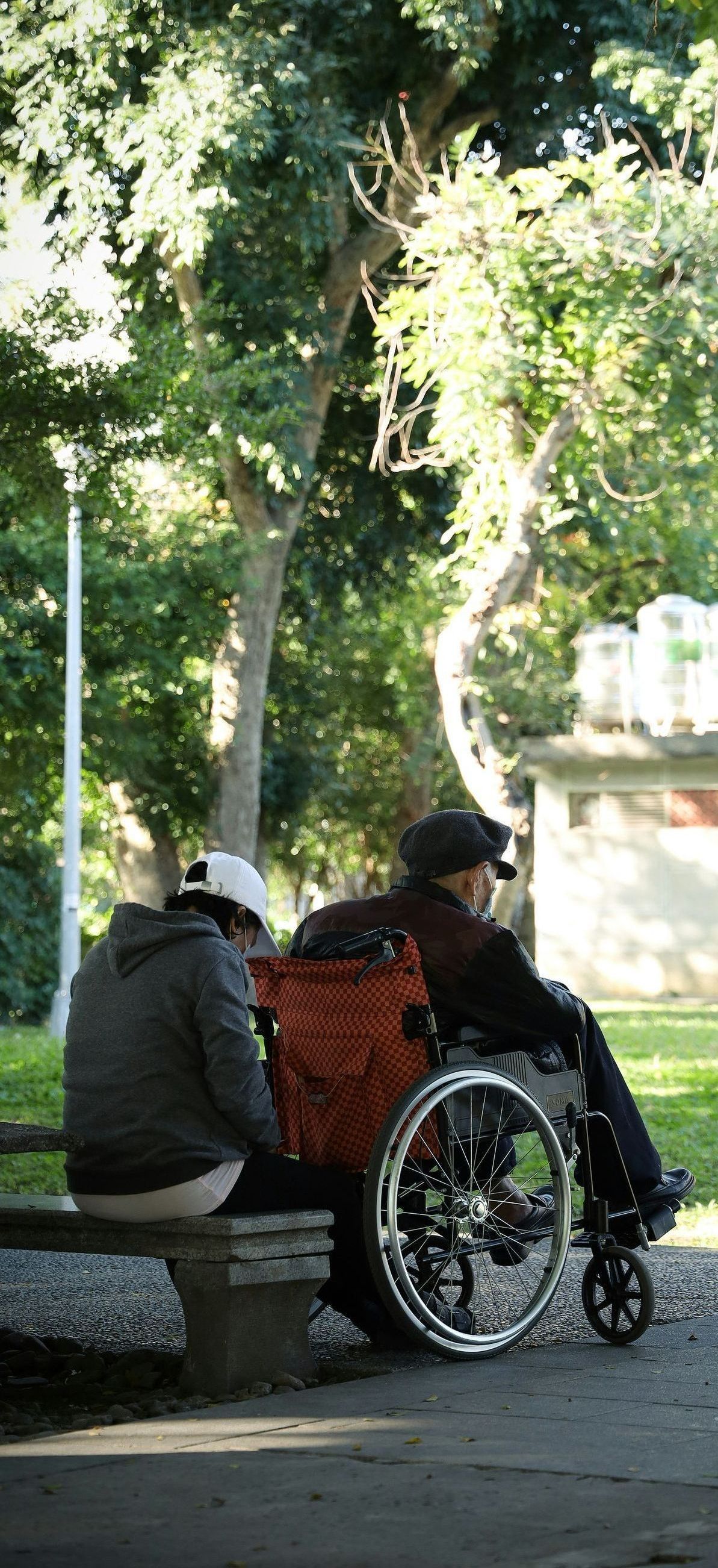 man outside in a wheelchair