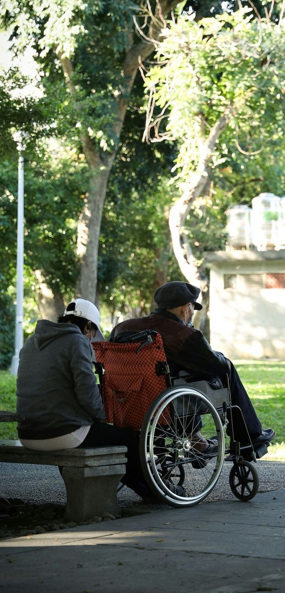 man outside in a wheelchair