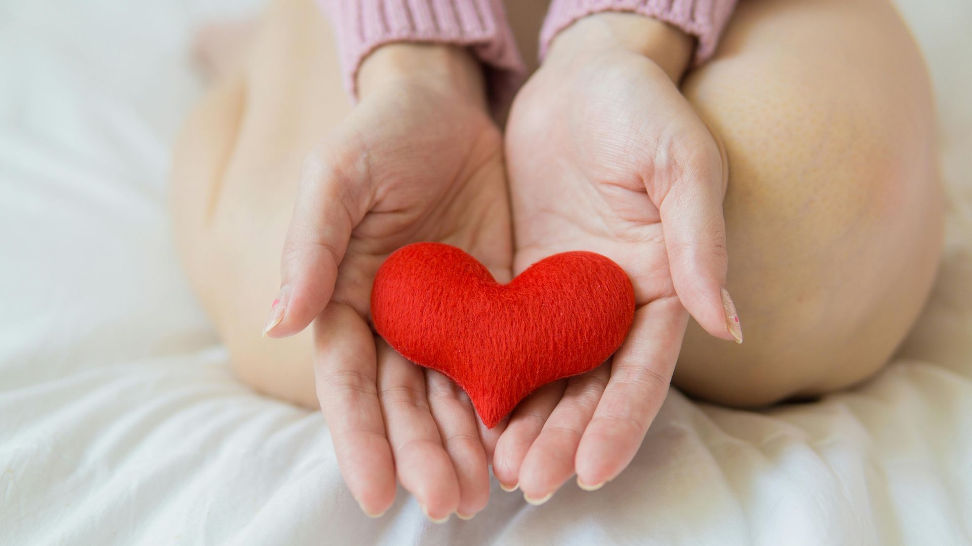 woman holding a heart