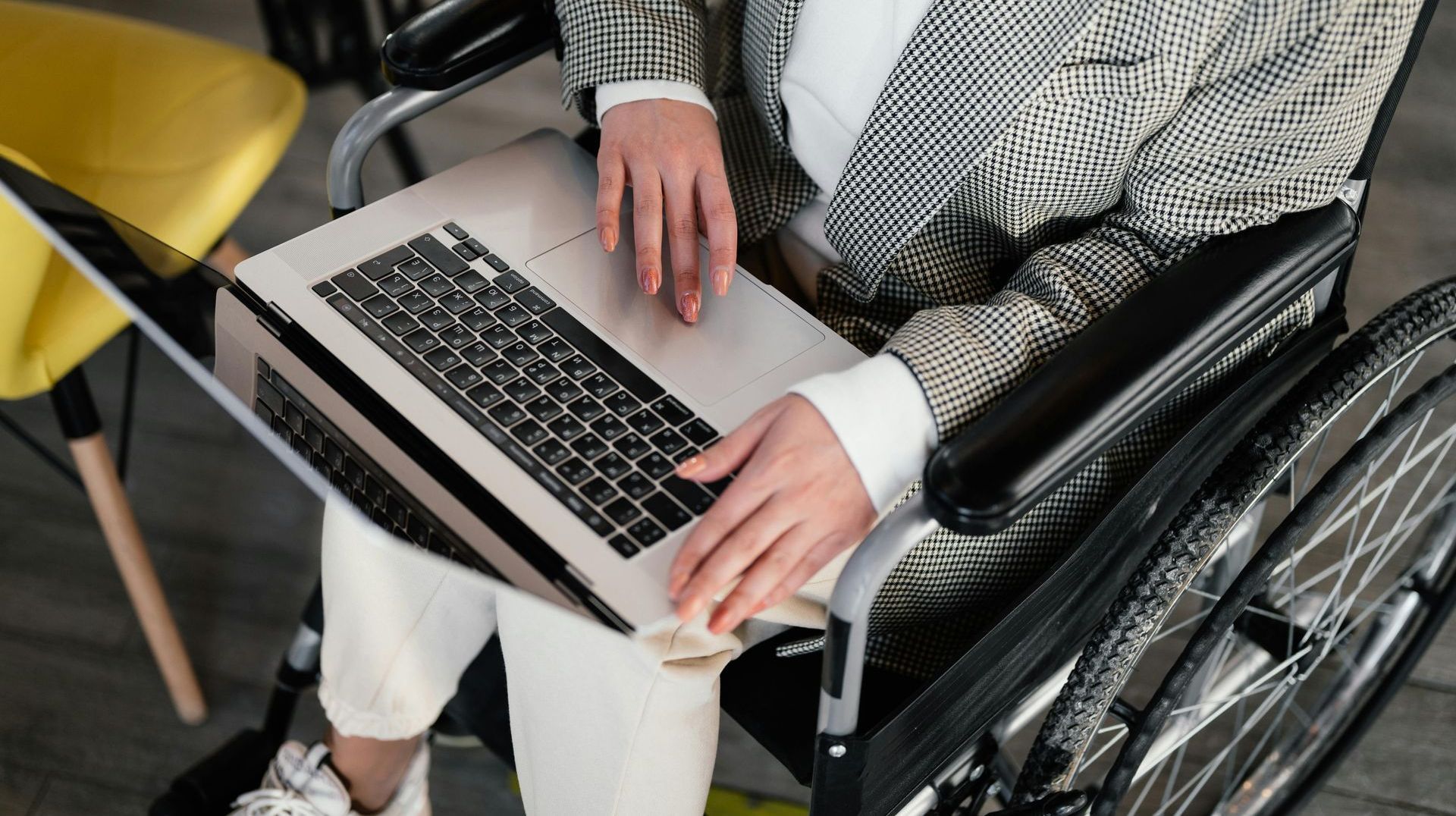 woman in a wheelchair on a laptop