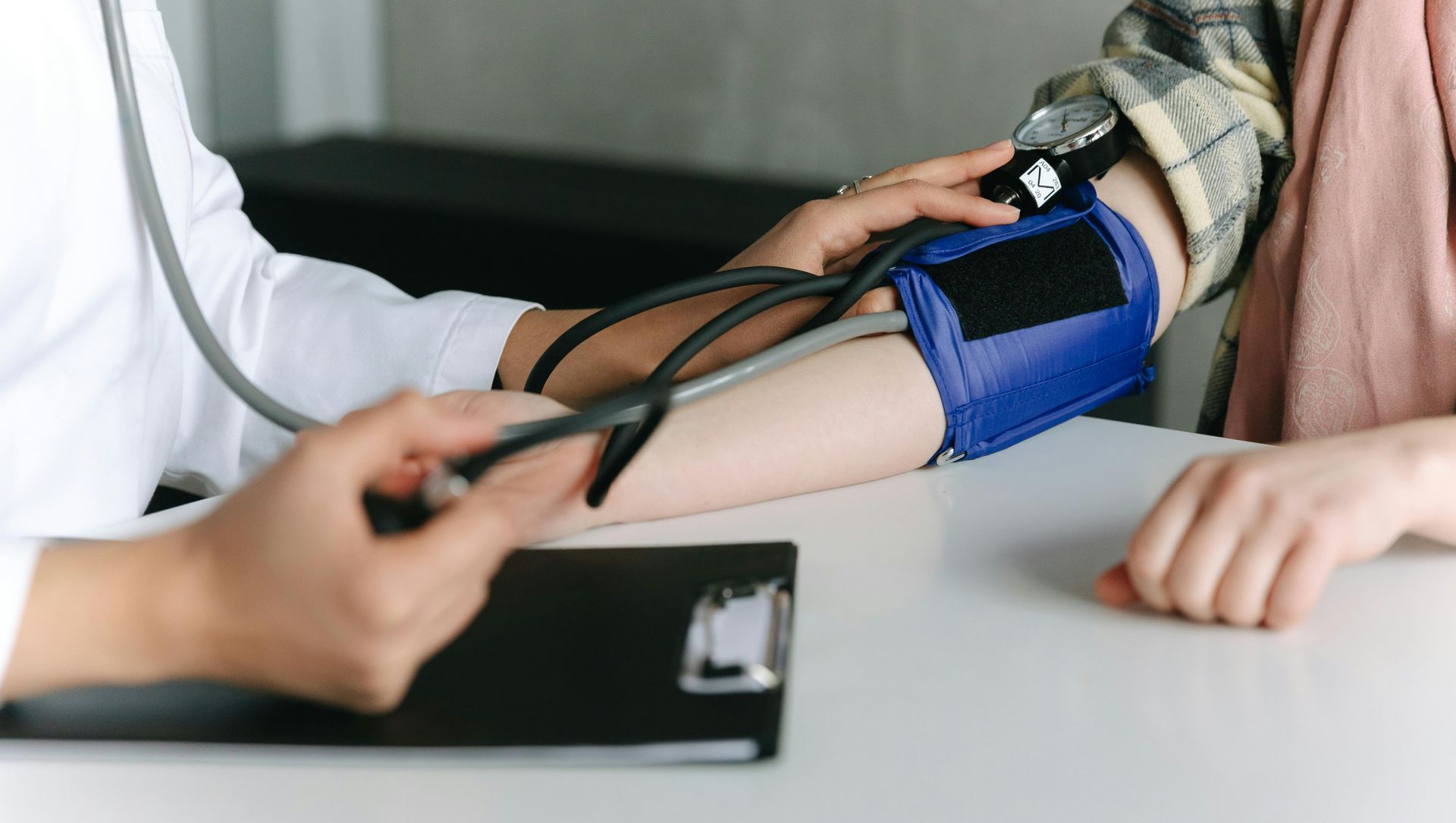 woman getting her blood pressure checked