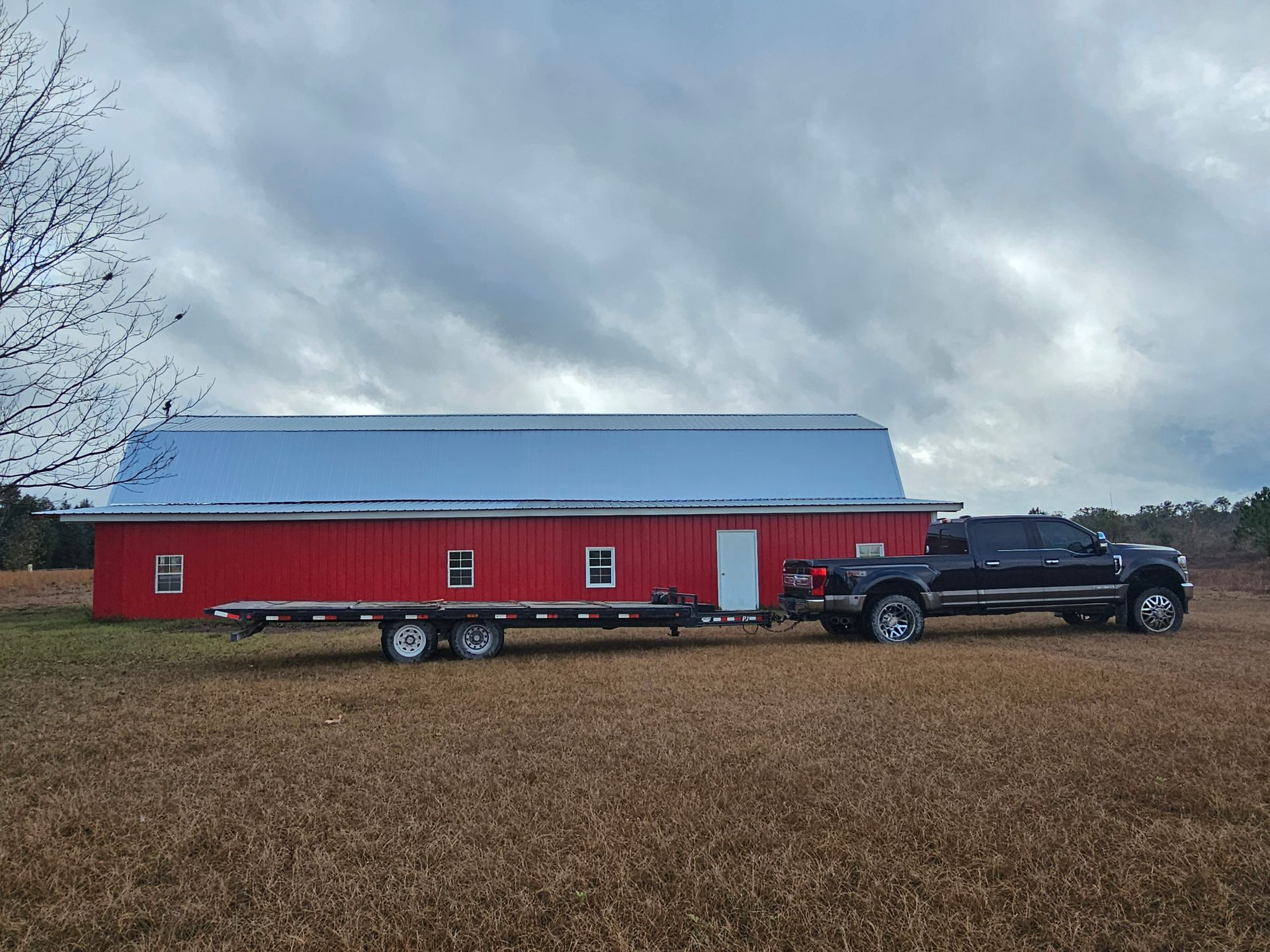 A wooden deck with chairs and a railing on a sunny day.