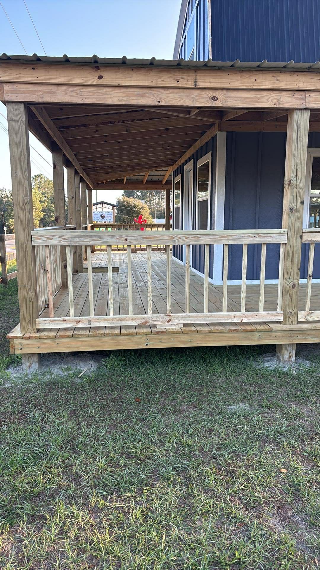 An aerial view of a house with a green roof