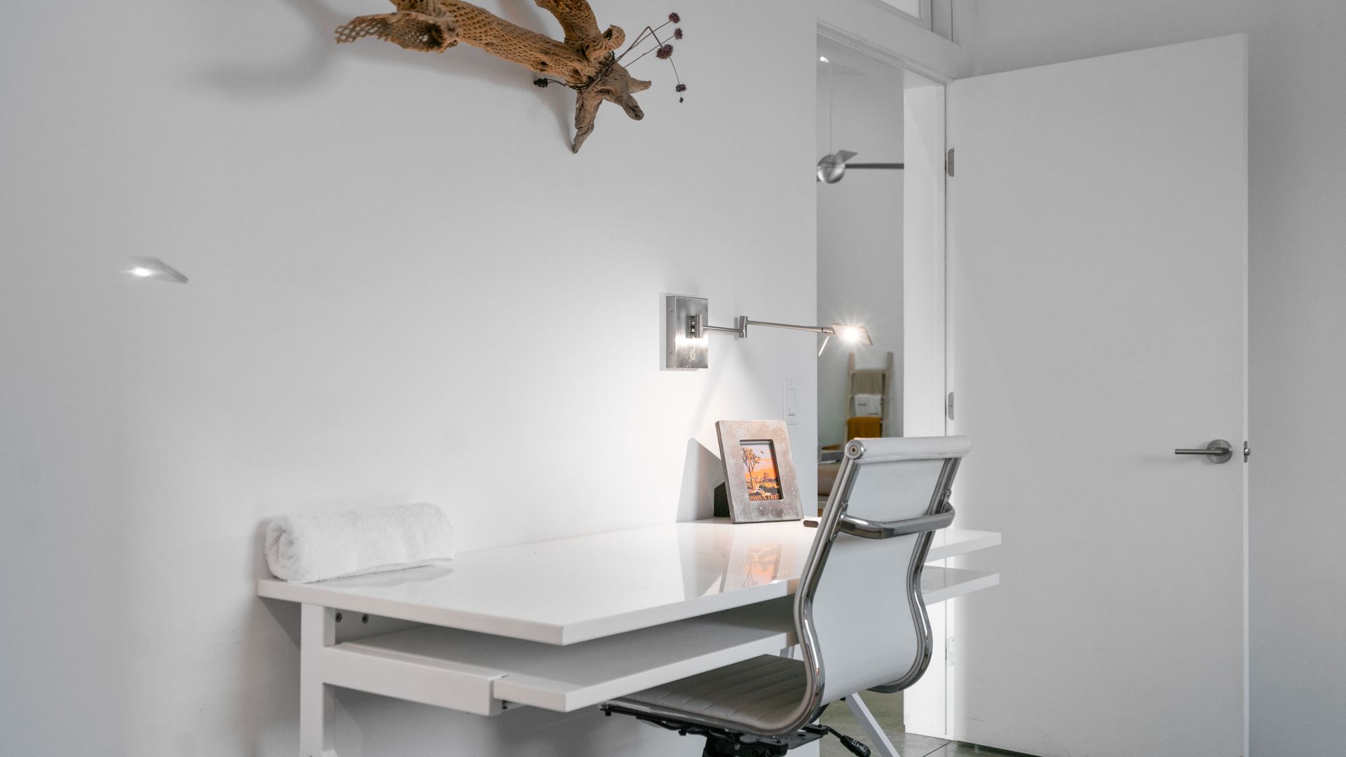 Liquor bottles on shelves behind a bar, various labels and colors, dimly lit interior.
