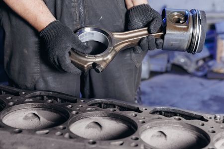 A white van is driving down a country road