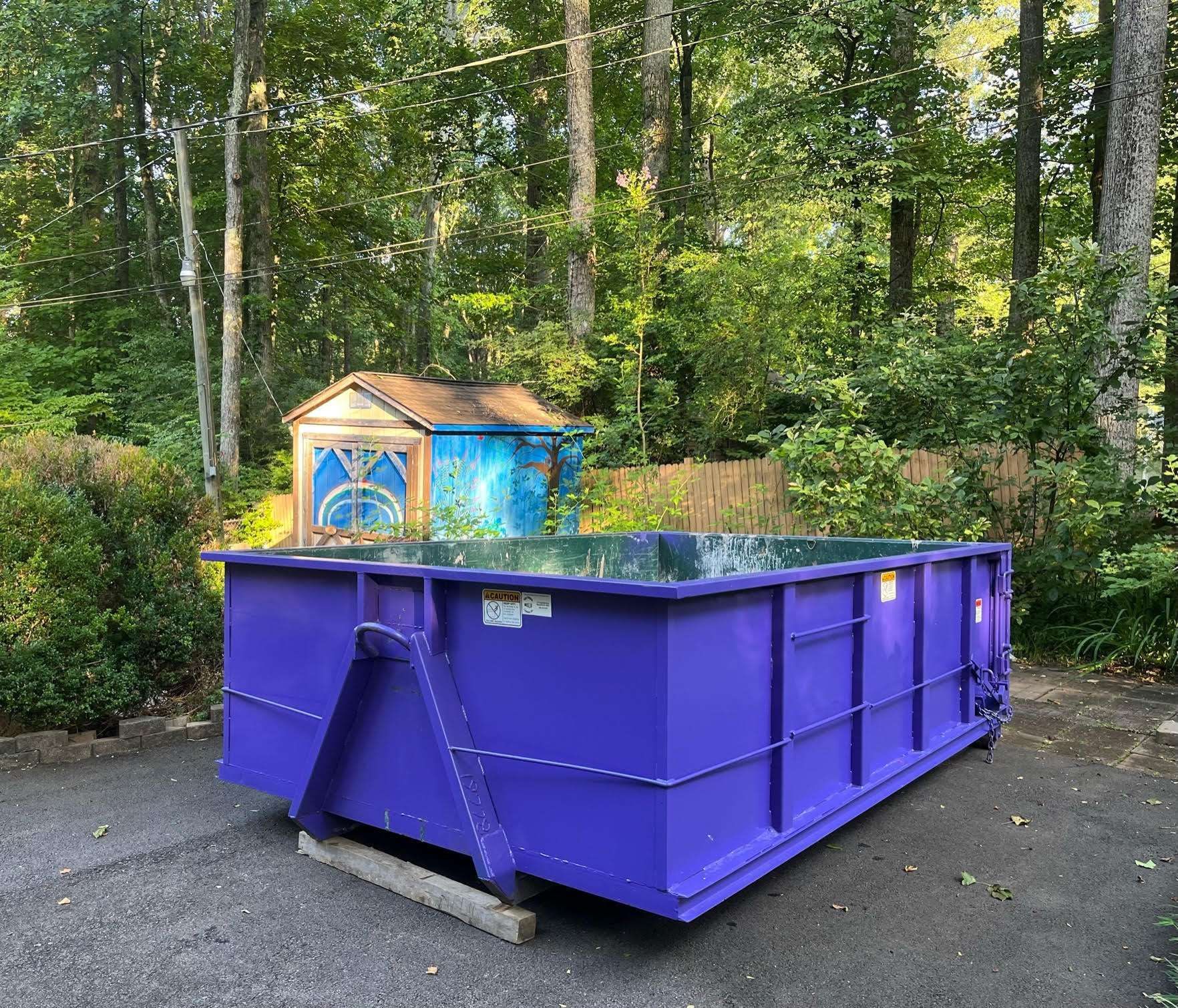 a dumpster filled with a lot of trash and junk .
