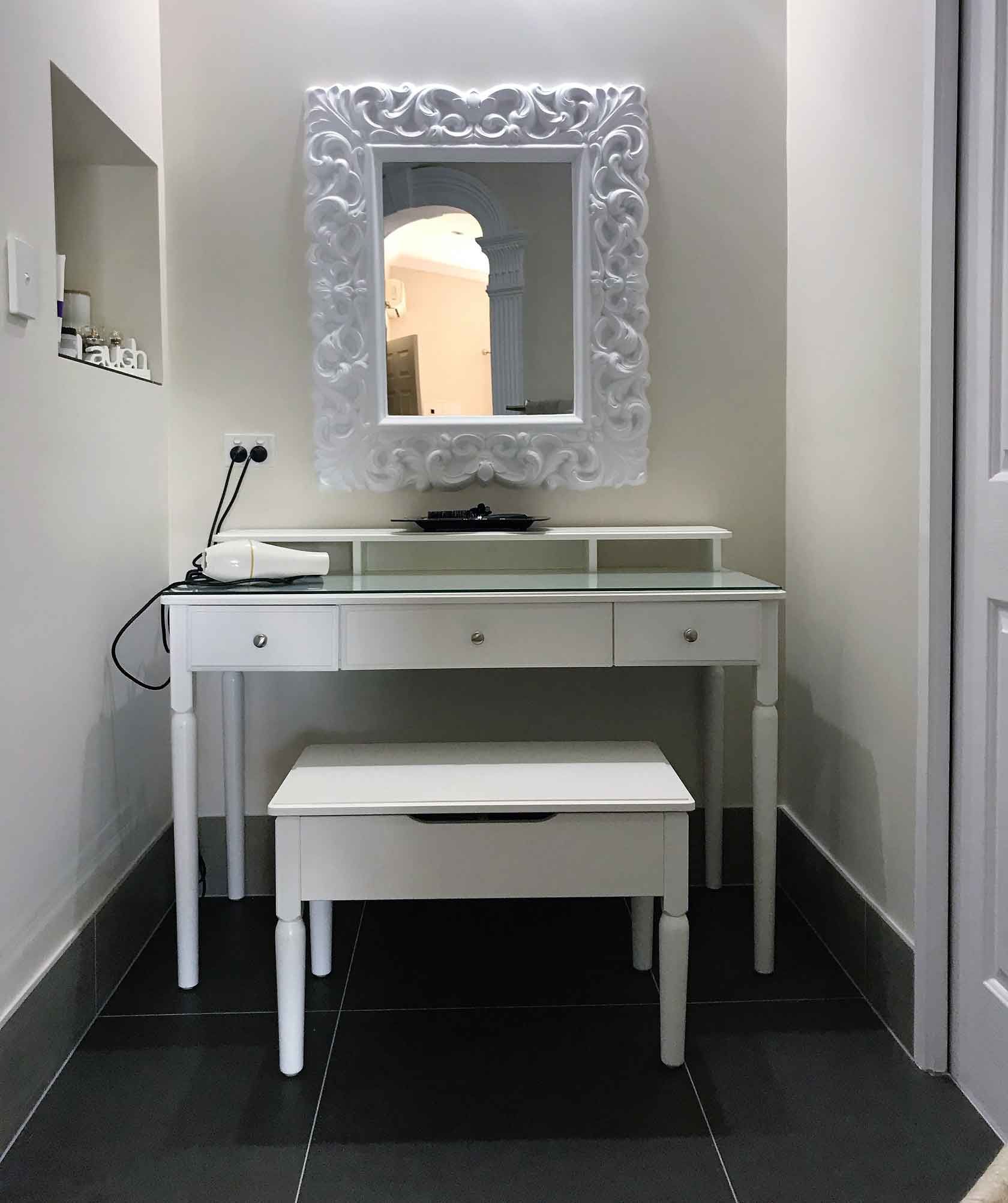 White bathroom with white chair and table — Manufacturing Cornices in Logan Village, QLD