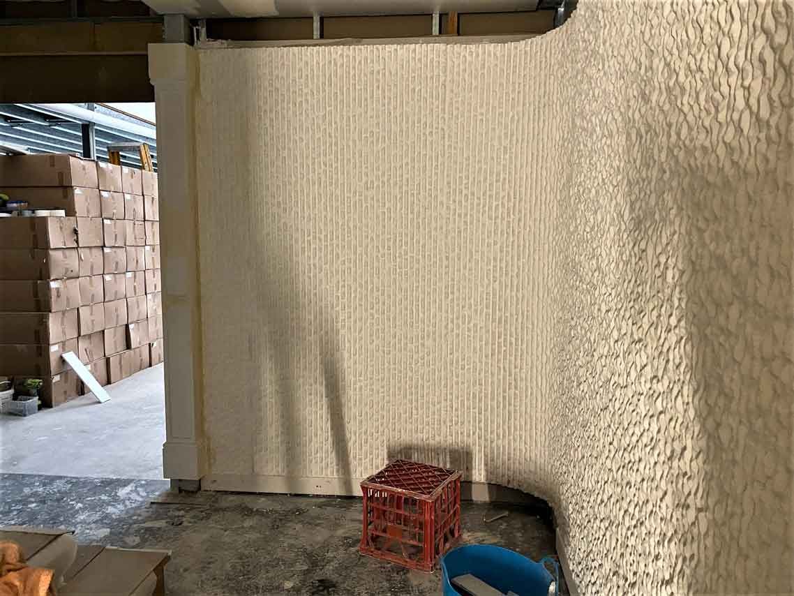 A warehouse with boxes stacked on top of each other and a crate on the floor.