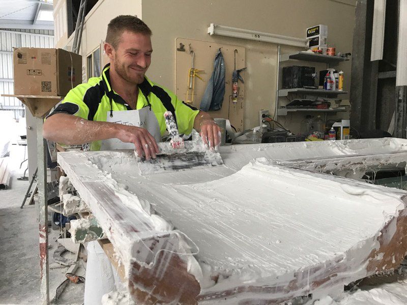 Worker Moulding a Cornice — Manufacturing Cornices in Logan Village, QLD