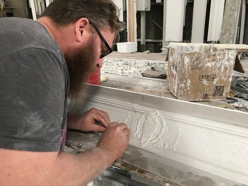 Worker Adding Details on Cornice — Manufacturing Cornices in Logan Village, QLD