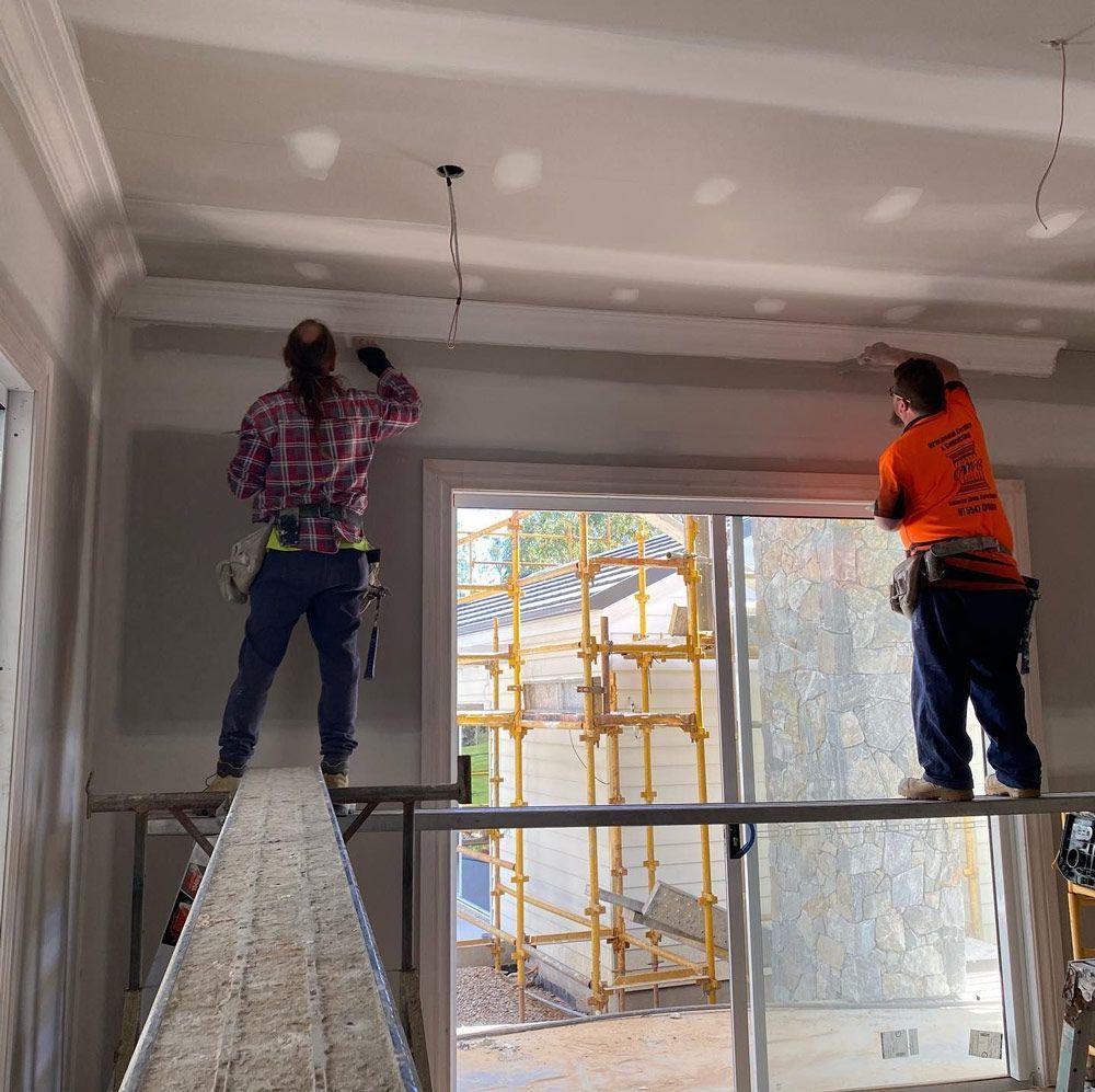 Team working renovating the ceiling — Manufacturing Cornices in Logan Village, QLD