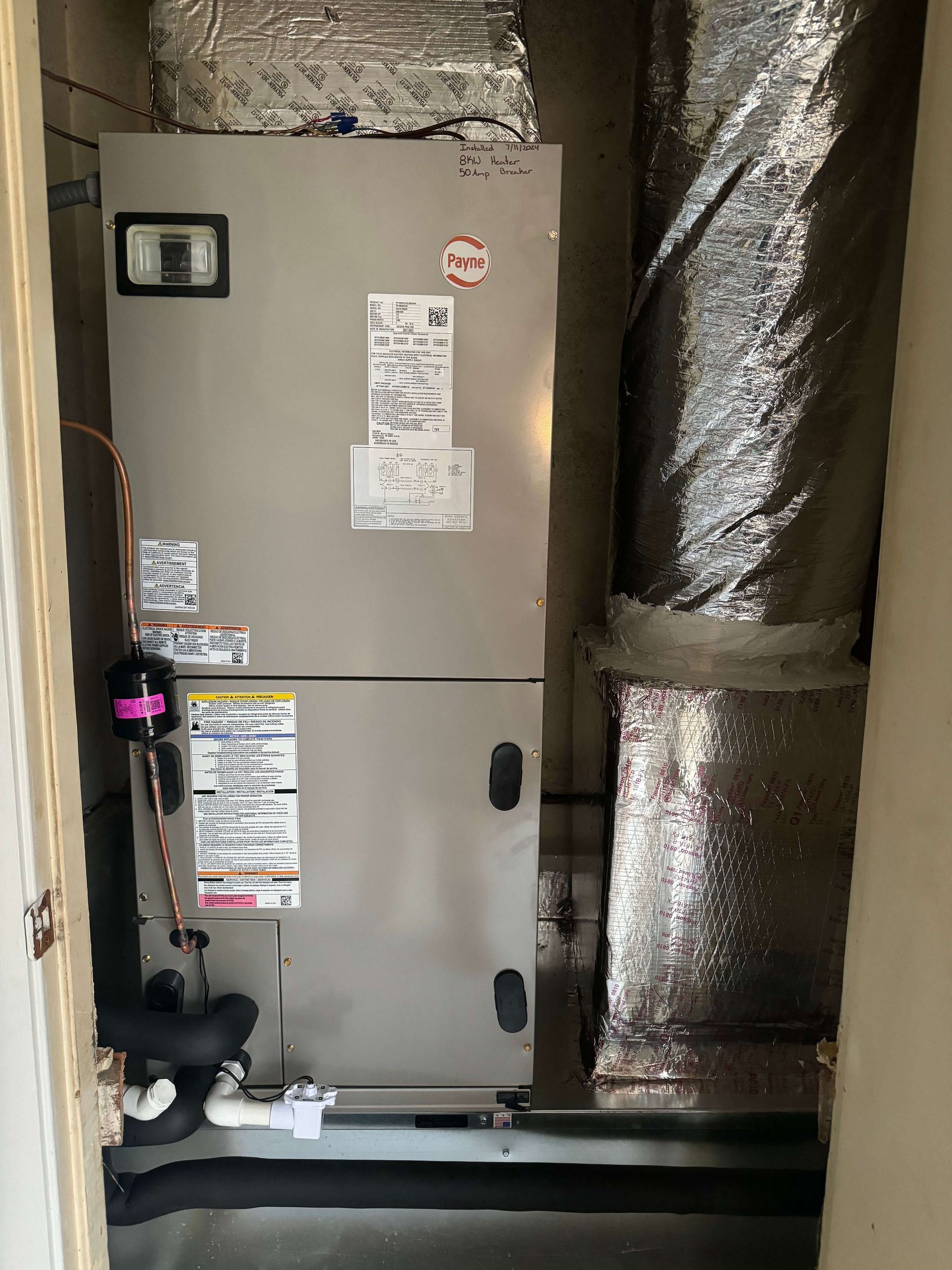 There is a refrigerator in the corner of a room.