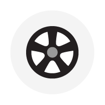 A black and white icon of a car wheel on a white background.