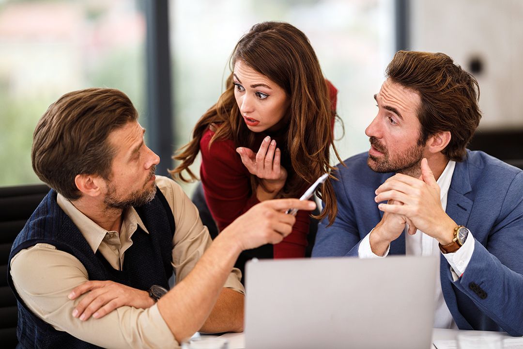 A group of professionals discussing communication strategies.