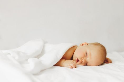Sleeping Baby on Bed — Maitland, FL — Beckman & Associates Inc.