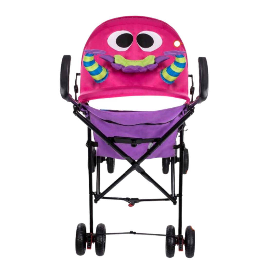 Un cochecito rosa y morado con una cara de monstruo.