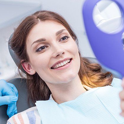 woman smiling on chair