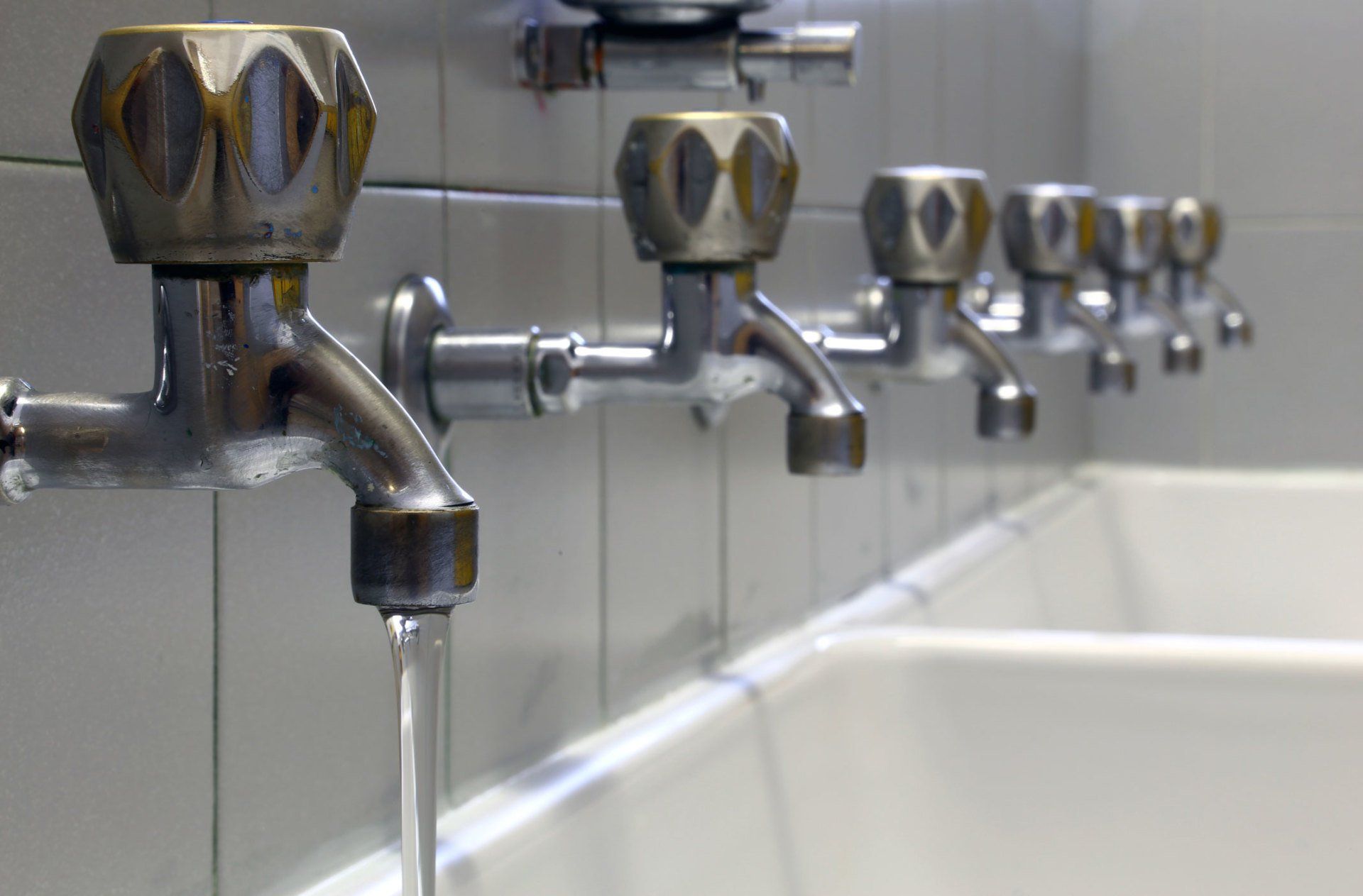 Commercial Pumps — Faucets Inside Restroom of a Commercial Building in Florence, AL