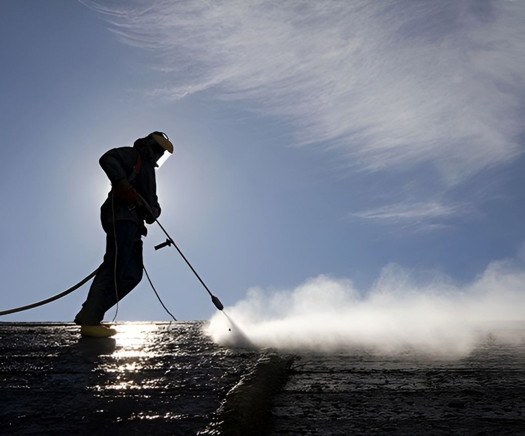 A Man Spraying a High-pressure Spray for Pest Control — Audy Geiszler Pest Control in Bowen, QLD