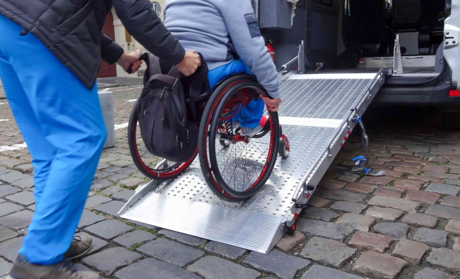A disabled person in a wheelchair using a car lift — Redcliffe, QLD — Achieve Disability Supports