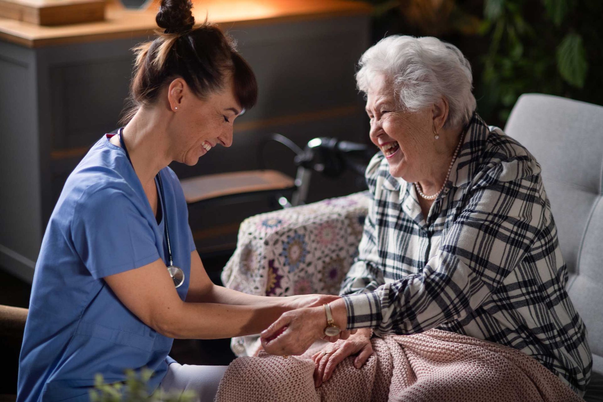 A female doctor doing check up to the senior woman — Redcliffe, QLD — Achieve Disability Supports