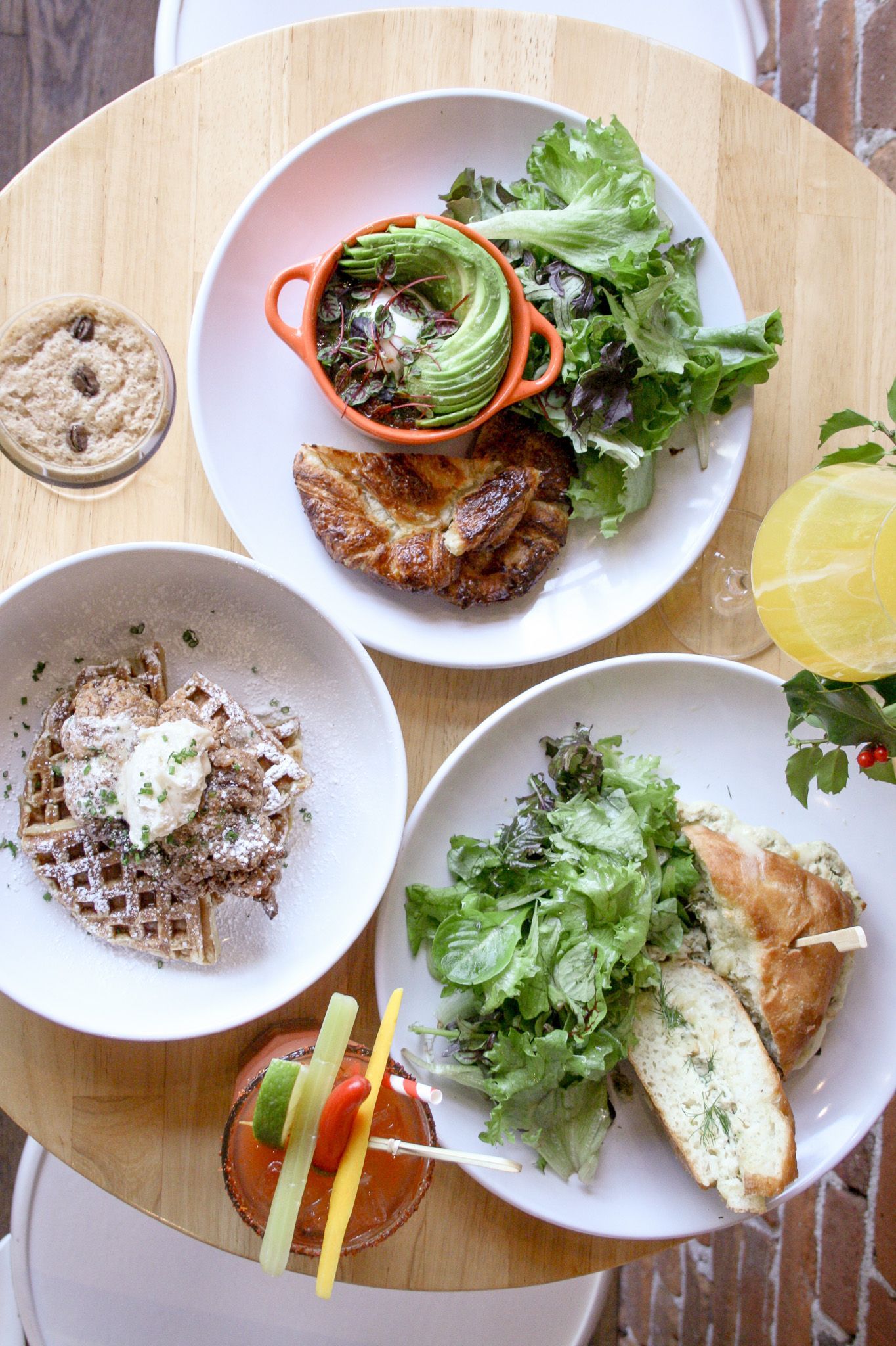 A man singing into a microphone while playing a piano