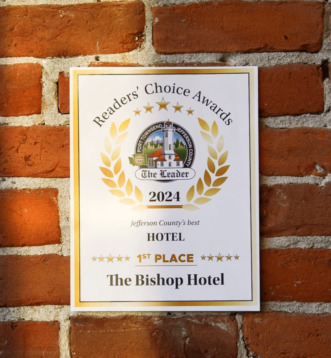 A man and a woman are posing for a picture and the man is holding a certificate that says best place to eat