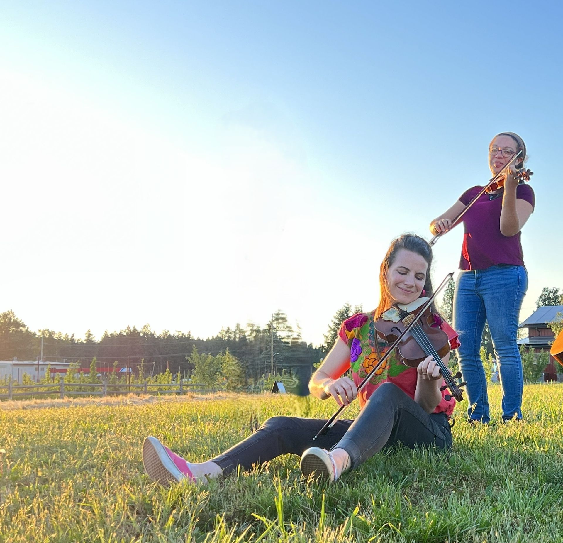 A man singing into a microphone while playing a piano