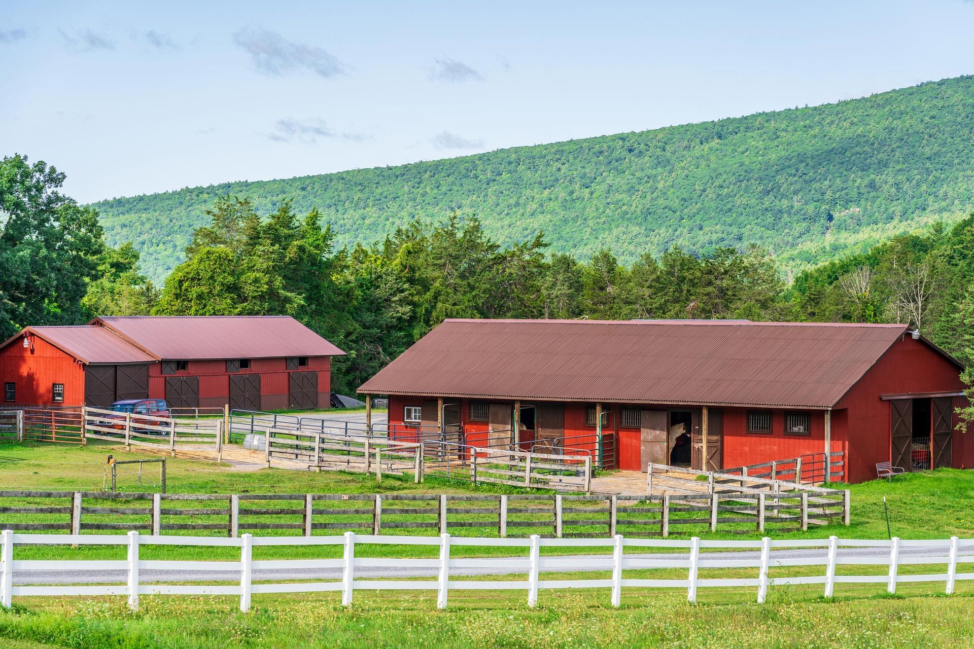 Red Colored Barn With a White Fence — Waco, TX — Bill Haddox Insurance