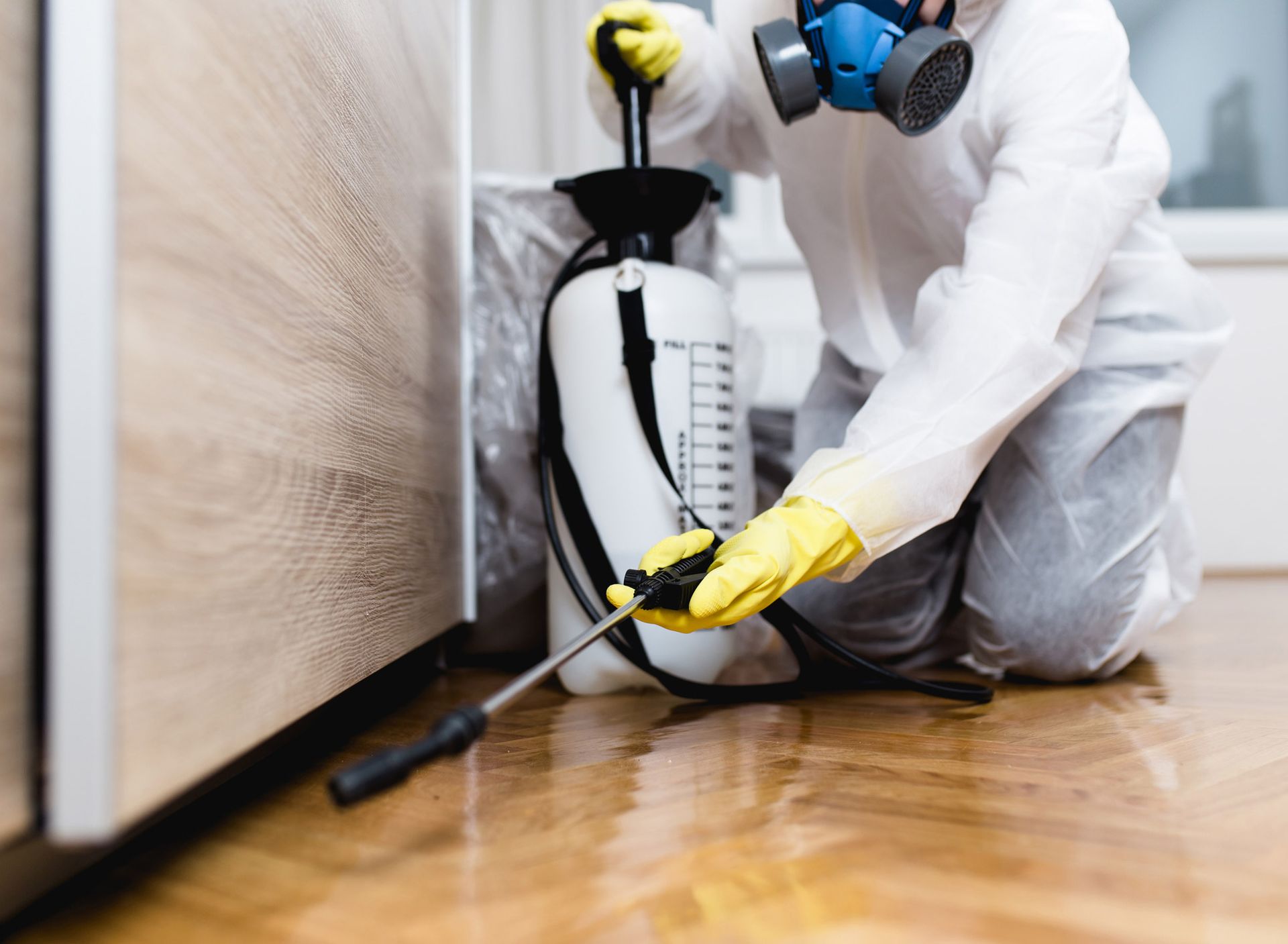 Man Spraying Pesticide — Wichita, KS — Bugs R Us And Bluebird Chimney