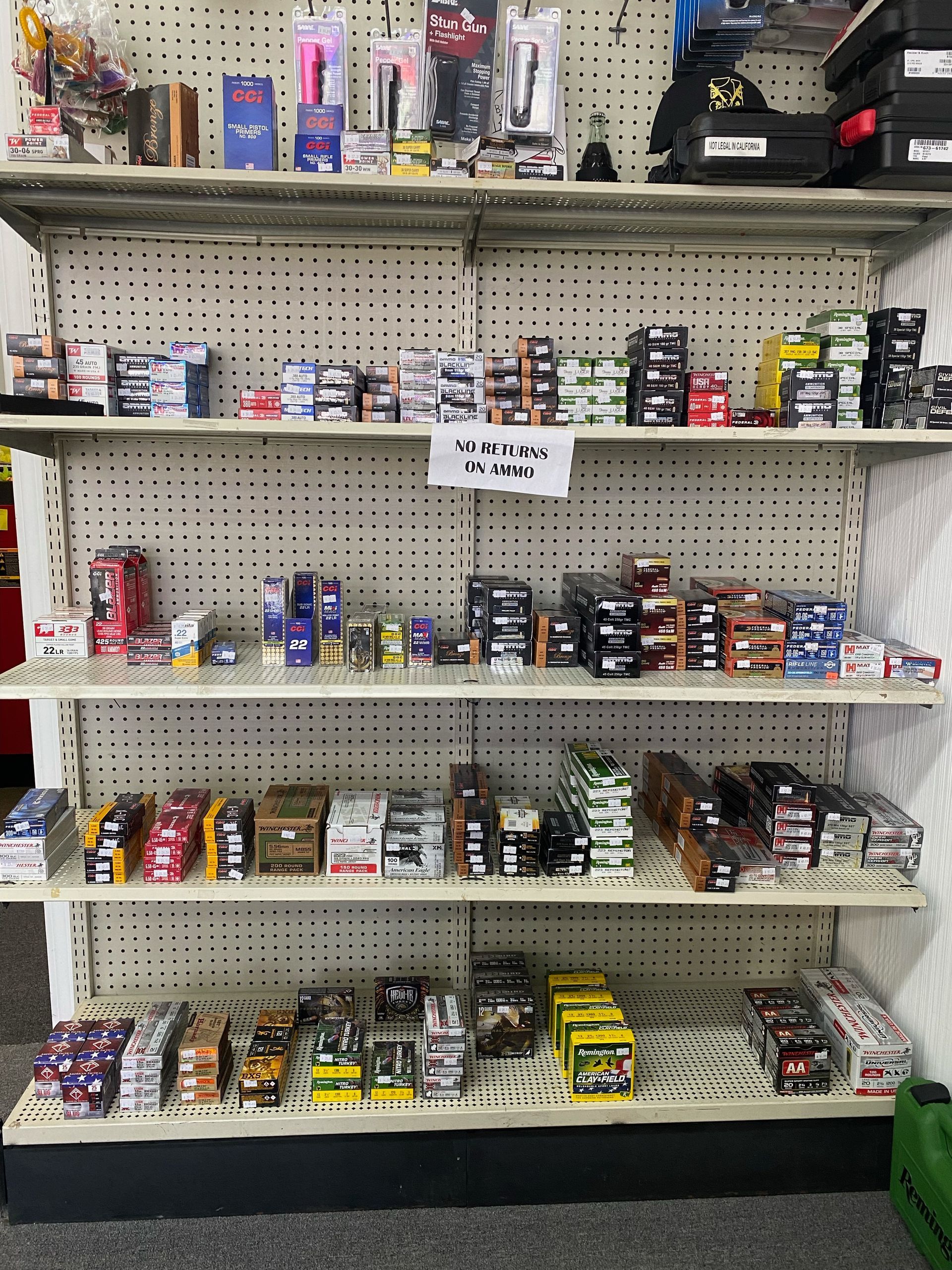 Shelves filled with small retail items, including boxes, packaged products, and various collectibles.