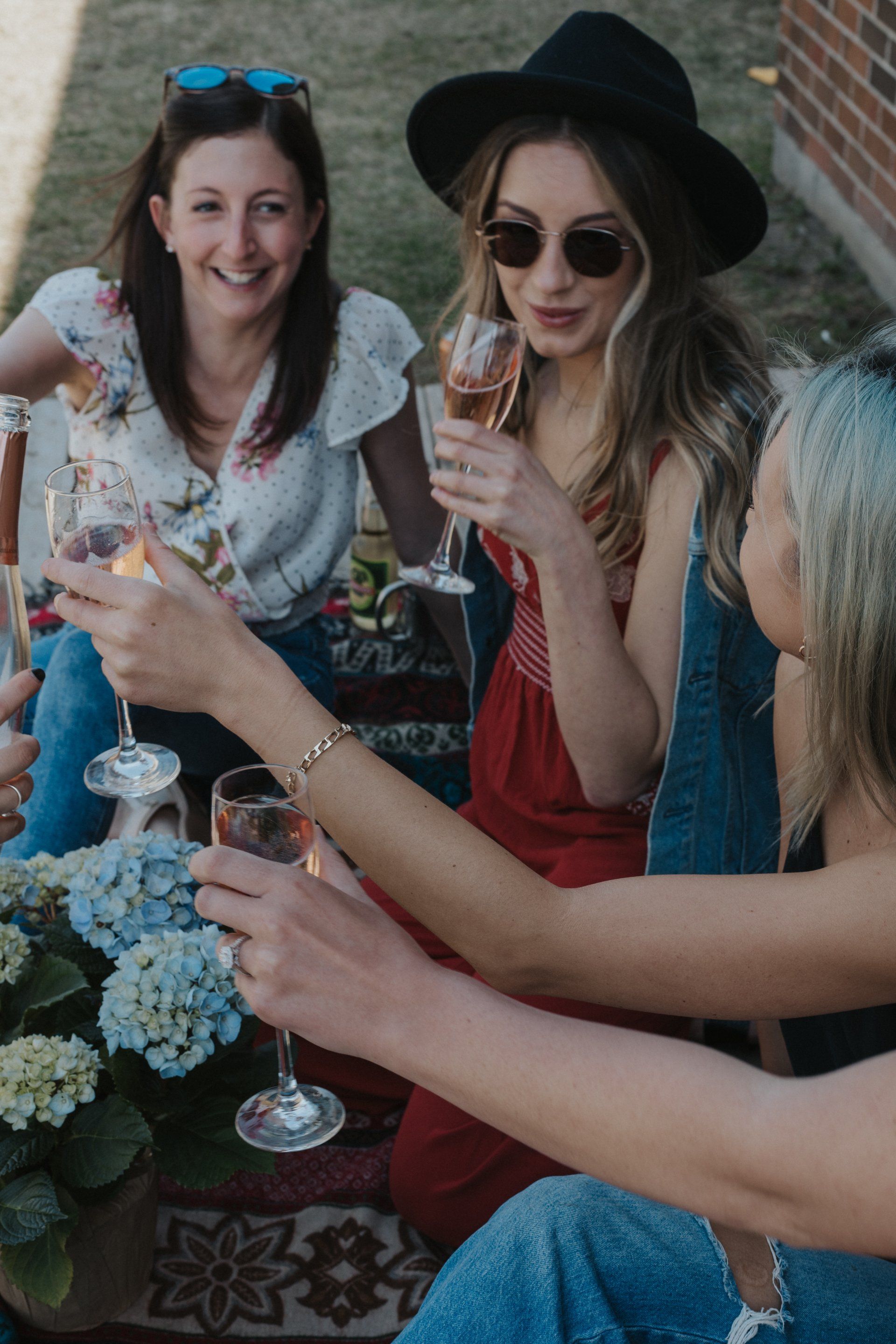 Three women having the best time on their winery tour in PEC