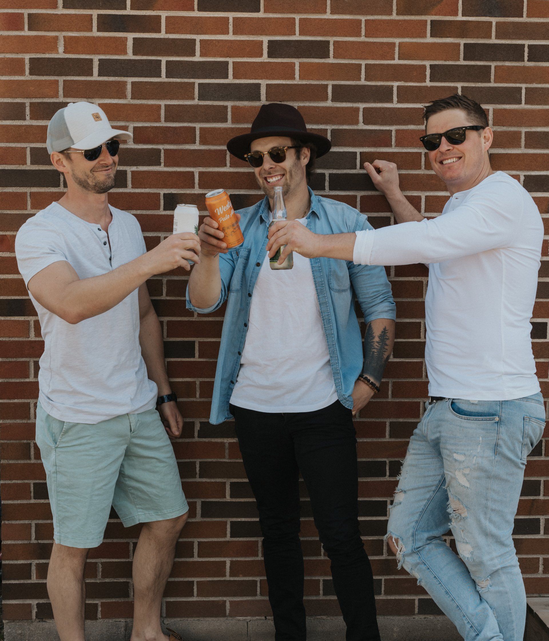 Three men drinking local craft beer in Kingston
